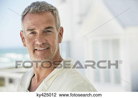 Stock Image - Portrait of a man smiling. Fotosearch