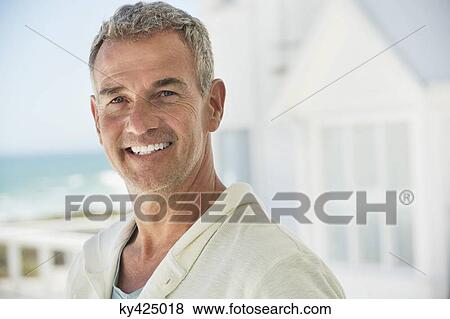Portrait of a man smiling View Large Photo Image Stock Photo - Portrait of a man smiling. Fotosearch
