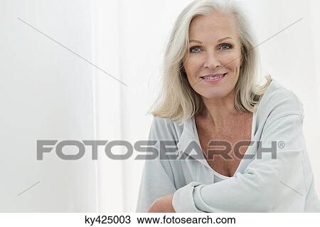 Stock Image - Portrait of a woman smiling. Fotosearch