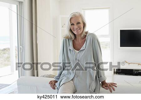 Stock Image - Portrait of a woman smiling. Fotosearch