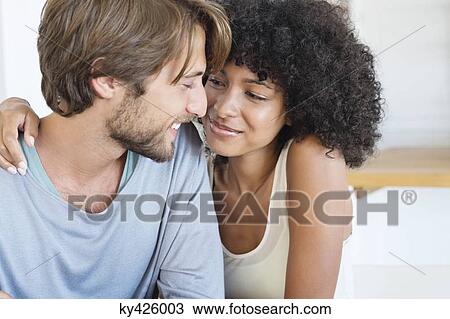 Stock Image - Close-up of a smiling couple in love. Fotosearch
