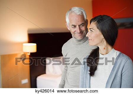Couple smiling in a hotel room View Large Photo Image Picture - Couple smiling in a hotel room. Fotosearch