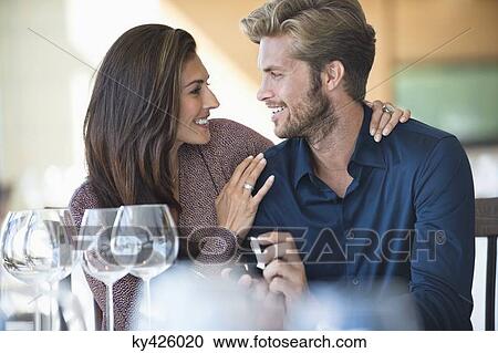 Man with engagement ring proposing his girlfriend in a restaurant View Large Photo Image Stock Image - Man with engagement ring proposing his girlfriend in a restaurant. Fotosearch