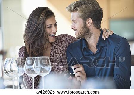 Man with engagement ring proposing his girlfriend in a restaurant View Large Photo Image Stock Photography - Man with engagement ring proposing his girlfriend in a restaurant. Fotosearch