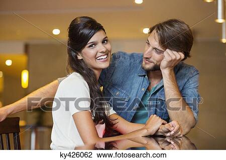 Portrait of a woman smiling with her friend beside her View Large Photo Image Stock Image - Portrait of a woman smiling with her friend beside her. Fotosearch
