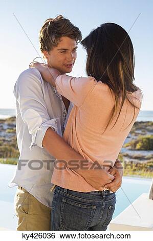 Stock Photograph - Romantic couple embracing each other. Fotosearch
