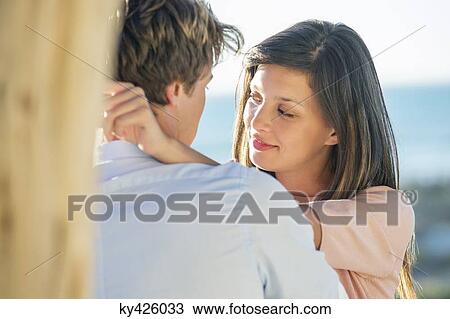 Stock Image - Romantic couple on the beach. Fotosearch
