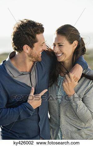 Smiling couple in love View Large Photo Image Stock Image - Smiling couple in love. Fotosearch