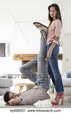 Woman helping her friend in exercising View Large Photo Image Stock Image - Woman helping her friend in exercising. Fotosearch