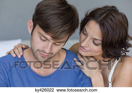 Woman persuading her upset husband View Large Photo Image Stock Image - Woman persuading her upset husband. Fotosearch
