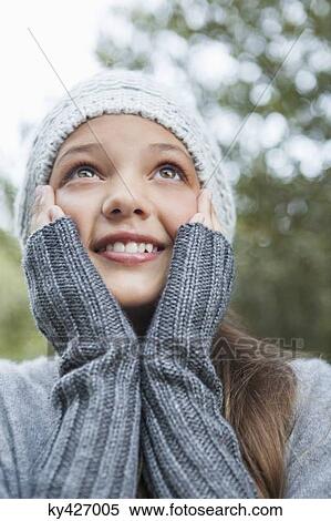 Stock Photography - Close-up of a girl day dreaming. Fotosearch