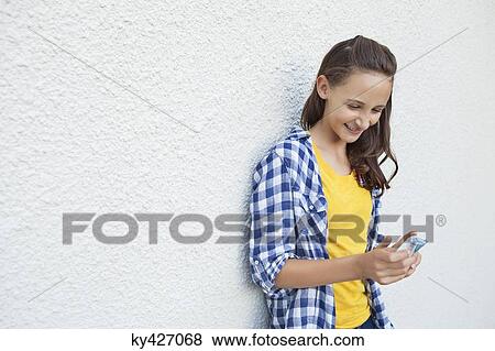 Happy girl looking at pocket money View Large Photo Image Stock Photo - Happy girl looking at pocket money. Fotosearch