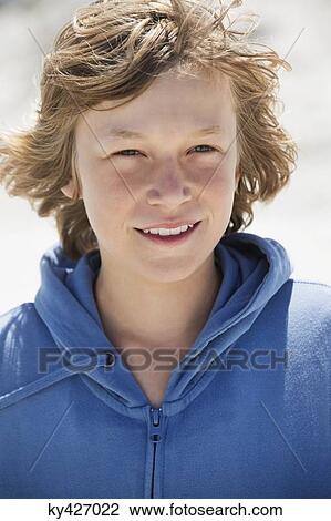 Portrait of a boy smiling on the beach View Large Photo Image Stock Image - Portrait of a boy smiling on the beach. Fotosearch