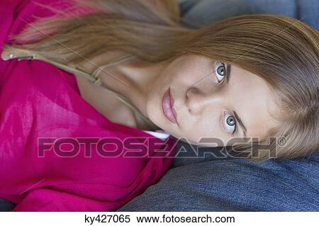 Stock Photography - Portrait of a girl lying down. Fotosearch