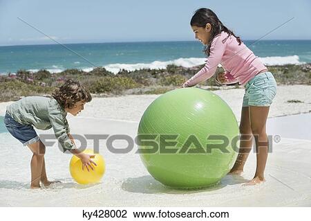 Children playing on the beach View Large Photo Image Stock Image - Children playing on the beach. Fotosearch