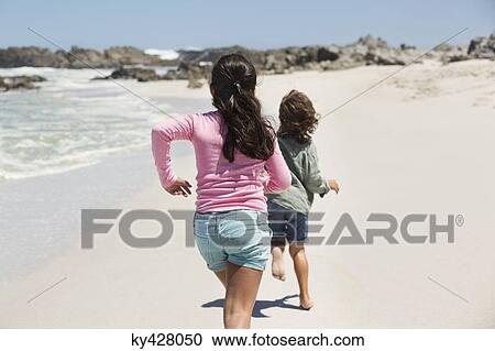 Children playing on the beach View Large Photo Image Stock Image - Children playing on the beach. Fotosearch