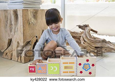 Girl playing with number blocks View Large Photo Image Stock Image - Girl playing with number blocks. Fotosearch