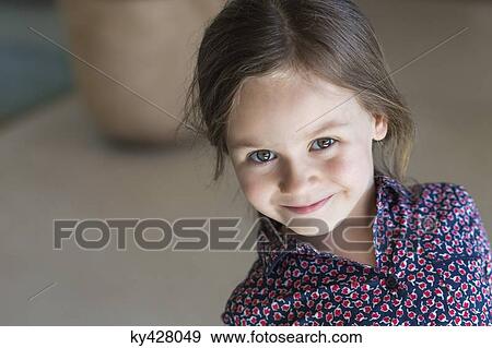 Stock Photo - Portrait of a girl smiling. Fotosearch