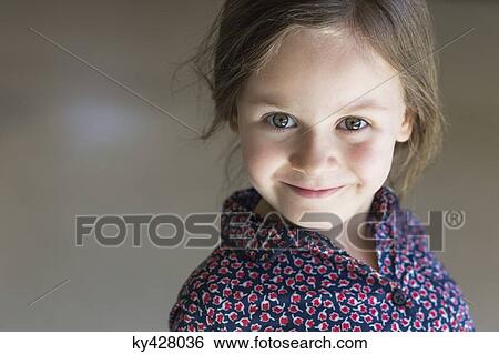 Stock Photograph - Portrait of a girl smiling. Fotosearch