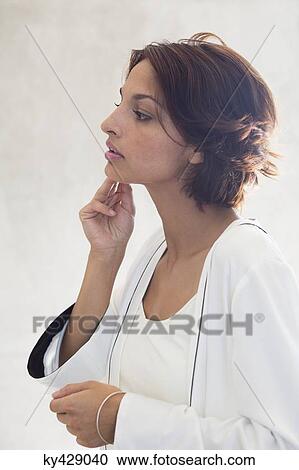 Woman checking wrinkles on her face View Large Photo Image Stock Image - Woman checking wrinkles on her face. Fotosearch