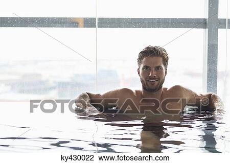 Man in a swimming pool View Large Photo Image Stock Image - Man in a swimming pool. Fotosearch