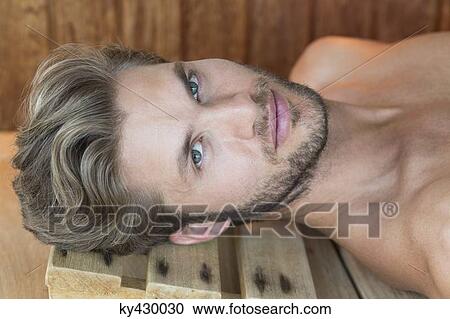 Portrait of a man resting in a sauna View Large Photo Image Stock Image - Portrait of a man resting in a sauna. Fotosearch