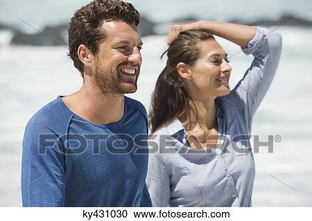 Close-up of a happy couple on the beach View Large Photo Image Stock Image - Close-up of a happy couple on the beach. Fotosearch