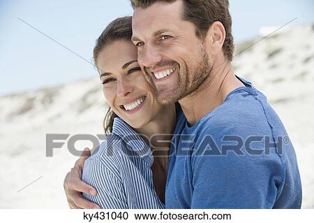 Close-up of a happy couple on the beach View Large Photo Image Stock Image - Close-up of a happy couple on the beach. Fotosearch