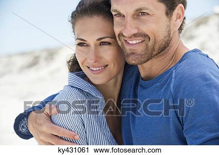 Close-up of a happy couple on the beach View Large Photo Image Stock Image - Close-up of a happy couple on the beach. Fotosearch