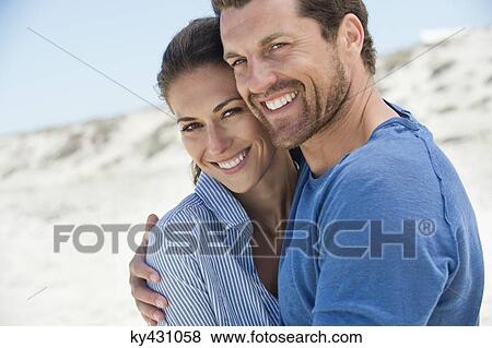 Close-up of a happy couple on the beach View Large Photo Image Stock Photo - Close-up of a happy couple on the beach. Fotosearch