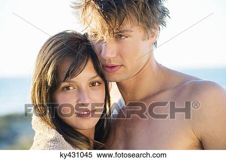 Stock Photography - Close-up of a romantic couple on the beach. Fotosearch