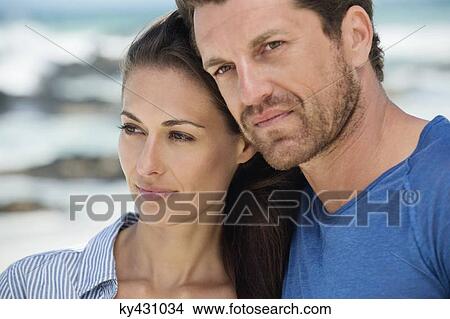 Couple on the beach View Large Photo Image Picture - Couple on the beach. Fotosearch