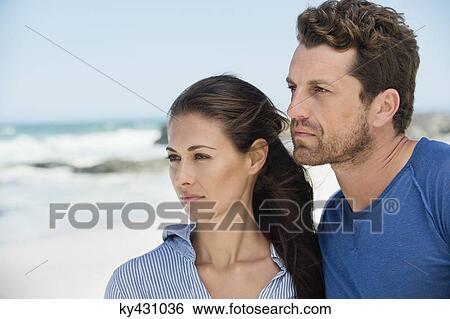Stock Photograph - Couple on the beach. Fotosearch