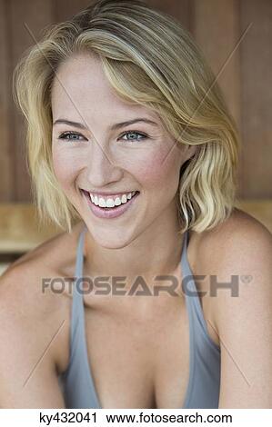 Stock Image - Close-up of a smiling woman in a sauna. Fotosearch