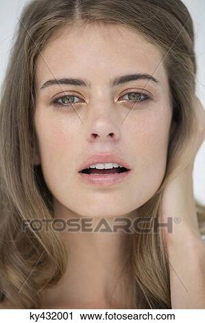 Stock Image - Portrait of a beautiful woman posing. Fotosearch