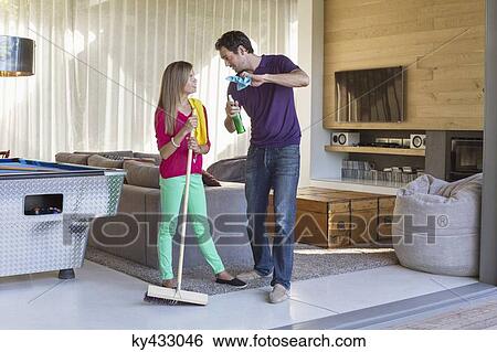 Father and daughter holding cleaning equipment and discussing View Large Photo Image Stock Photograph - Father and daughter holding cleaning equipment and discussing. Fotosearch