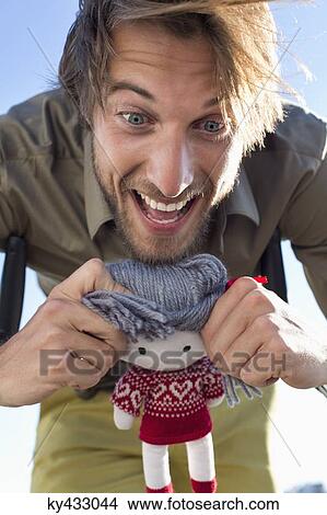 Man playing with a rag doll View Large Photo Image Picture - Man playing with a rag doll. Fotosearch