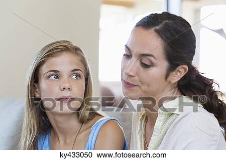 Woman discussing with her daughter View Large Photo Image Stock Image - Woman discussing with her daughter. Fotosearch