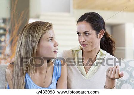 Woman discussing with her daughter View Large Photo Image Stock Image - Woman discussing with her daughter. Fotosearch