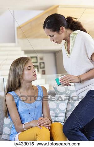 Stock Photography - Woman scolding her daughter at home. Fotosearch