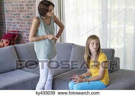 Woman scolding her daughter View Large Photo Image Stock Photo - Woman scolding her daughter. Fotosearch