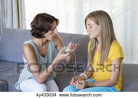 Woman talking to her daughter View Large Photo Image Picture - Woman talking to her daughter. Fotosearch