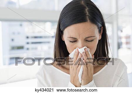 Close-up of a woman sneezing View Large Photo Image Stock Image - Close-up of a woman sneezing. Fotosearch
