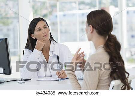 Female doctor discussing with a patient View Large Photo Image Stock Photography - Female doctor discussing with a patient. Fotosearch