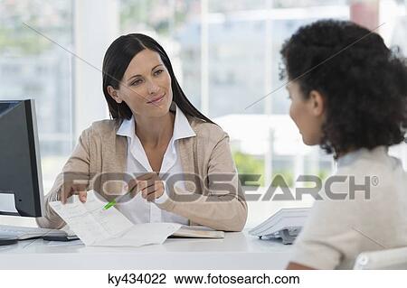 Female doctor showing medical report to a patient View Large Photo Image Stock Image - Female doctor showing medical report to a patient. Fotosearch