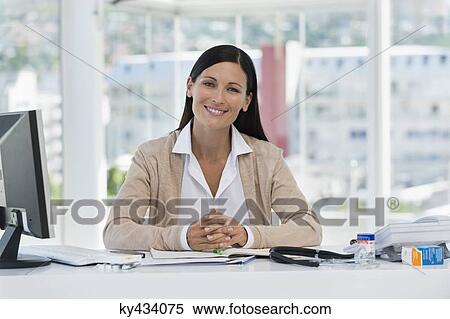Portrait of a smiling receptionist in a doctor's office View Large Photo Image Stock Photography - Portrait of a smiling receptionist in a doctor's office. Fotosearch
