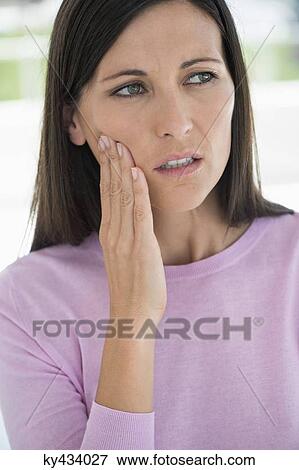 Woman suffering from a toothache View Large Photo Image Stock Photo - Woman suffering from a toothache. Fotosearch