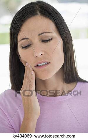Woman suffering from a toothache View Large Photo Image Stock Photo - Woman suffering from a toothache. Fotosearch