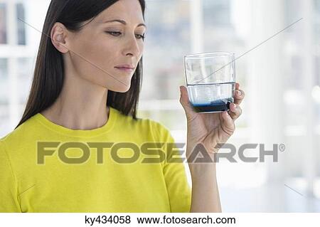 Woman taking medicine View Large Photo Image Stock Photo - Woman taking medicine. Fotosearch