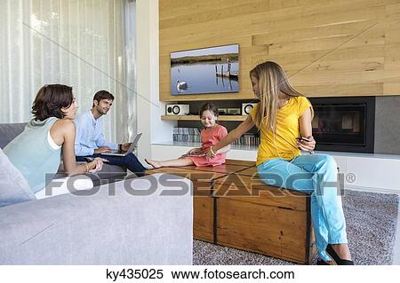 Family using electronics gadgets View Large Photo Image Stock Photography - Family using electronics gadgets. Fotosearch